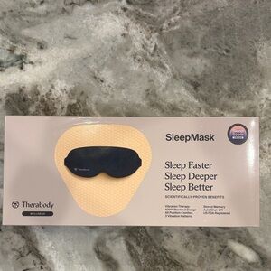Therabody SleepMask Eye Mask in Black and Pale Pink Box